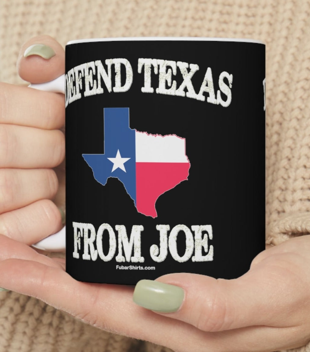 woman holding Defend Texas from Joe coffee mug by fubarshirts.com