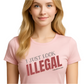 Person wearing a pink t-shirt with 'I JUST LOOK ILLEGAL' . Free Shipping. Unisex. 
