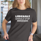 Person wearing a black t-shirt with 'LIBERALS SHOULD STOP BREATHING' text.