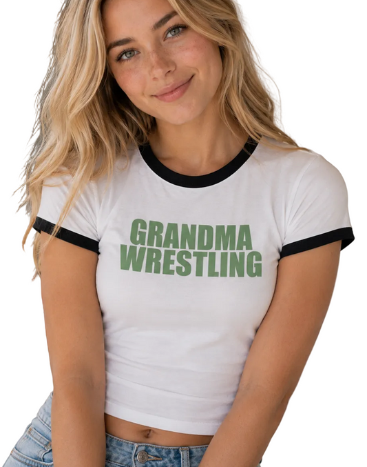 Grandma Wrestling Penny Tee. Unisex. Free Shipping. FubarShirts.com. White Shirt, Black hem, Green text font.