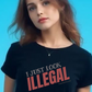Person wearing a black t-shirt with 'I Just Look Illegal' text. FREE SHIPPING. UNISEX.