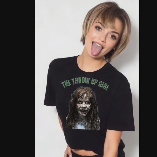 The Throw Up Girl T-shirt worn by model sticking out her tongue on video.