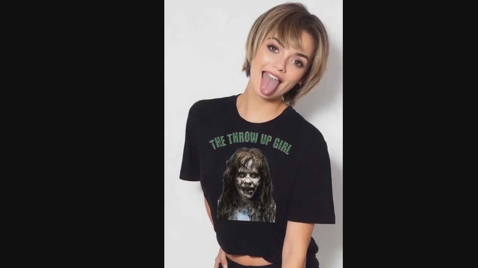 The Throw Up Girl T-shirt worn by model sticking out her tongue on video.