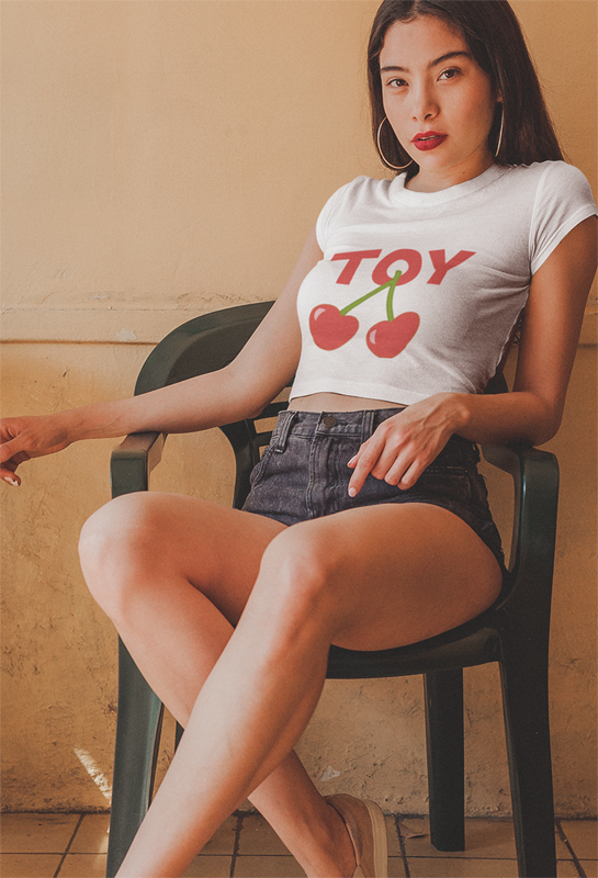 Girly crop top with cherries and the word Toy.